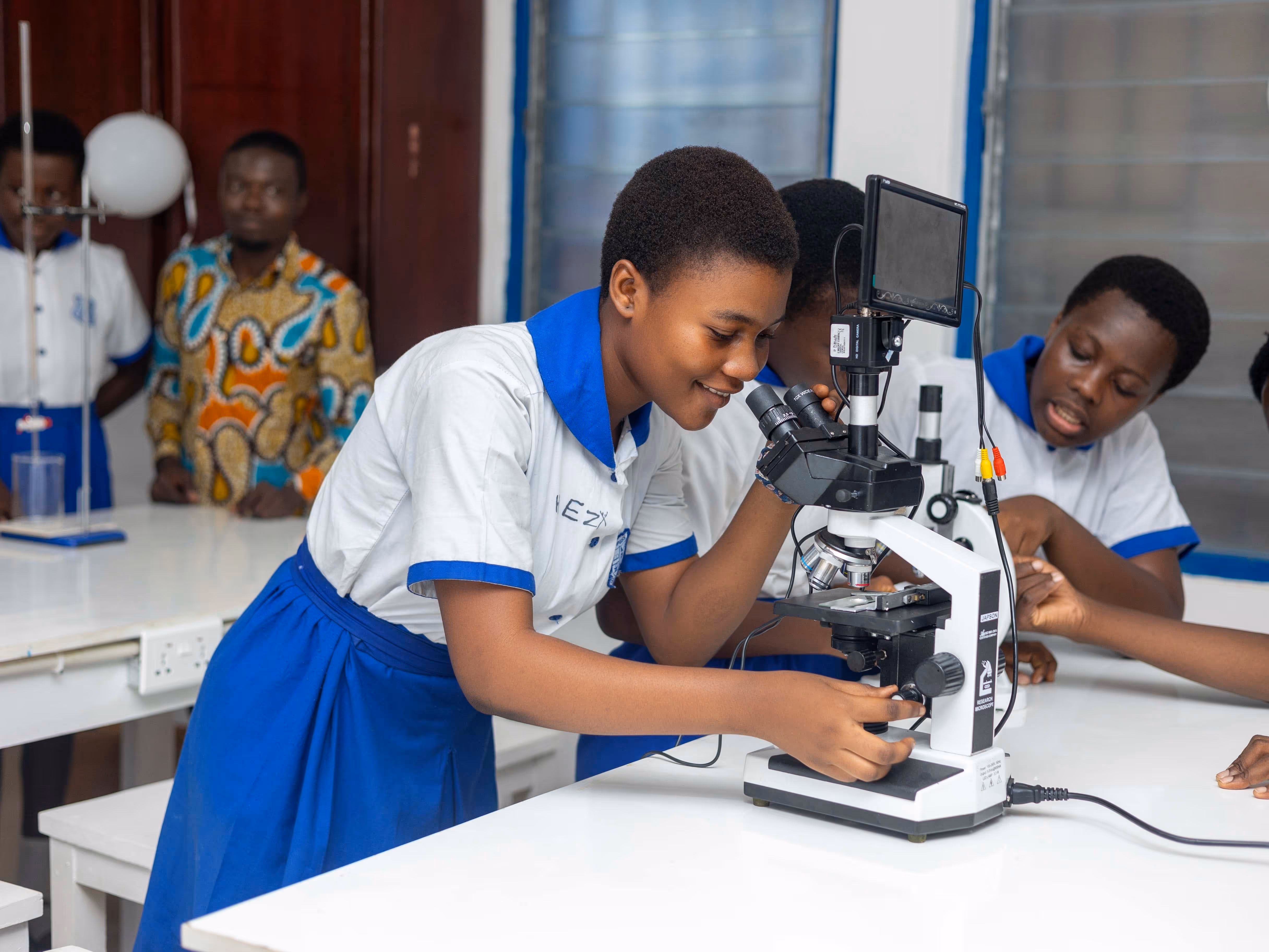 Young student in a science lab are using their science  equipment